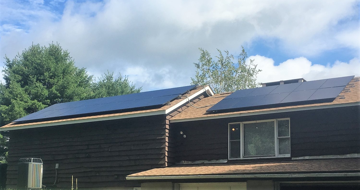 A solar-panel installation by SEEDS volunteers at the Lacawac Sanctuary visitor center. Solar energy is just one example of the clean energy projects that the Inflation Reduction Act of 2022 could fund.